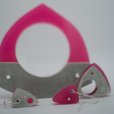 set of Dhoek pewter bangle, ring and earrings in pink with cut out reveals