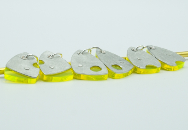 3 sets of Dhoek earrings pewter and neon yellow