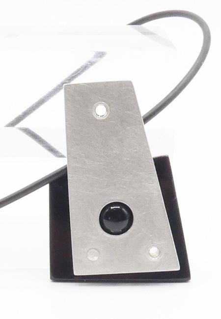 Black Hebbe pendant with front visible onyx cabochon insert