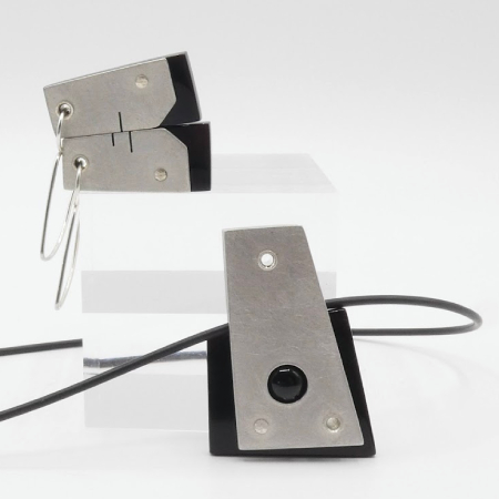 Hebbe pewter and black pendant and earrings with cut out reveals and black onyx cabochon insert