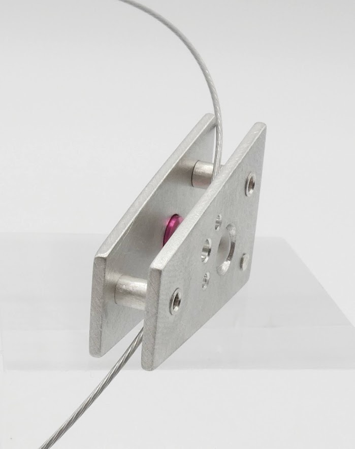 Hebbe pendant with clear crystal sphere insert which changes colour through pink washer behind