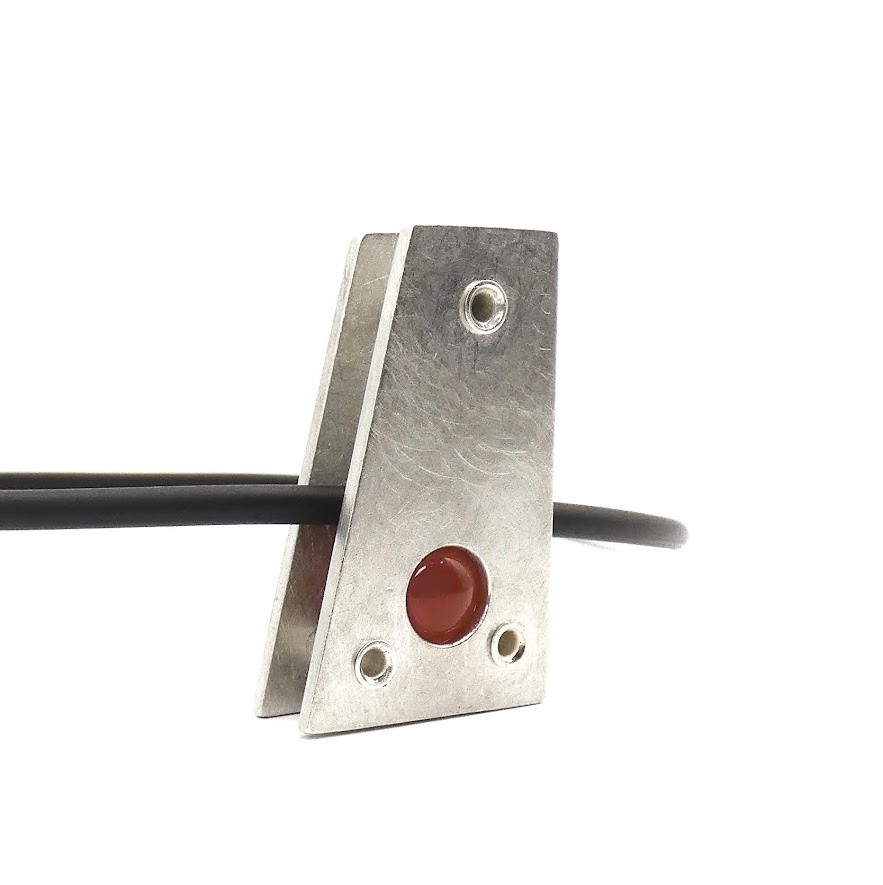 Hebbe pewter pendant with red carnelian spherre insert peeping through