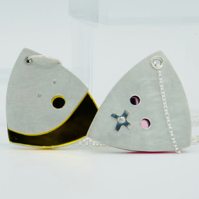 silent or shout out loud pendants in mirror yellow and mirror pink