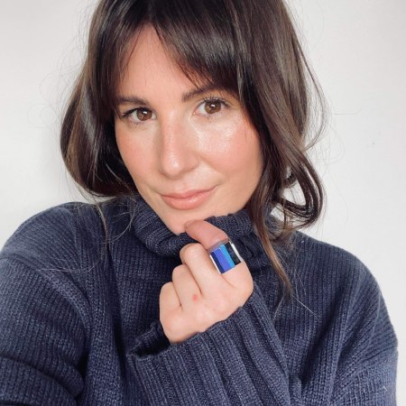 model wearing a blue jumper showing a blue bold cubist pewter and acryllic ring