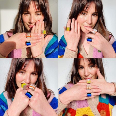 Window showing 4 images of model wearing multiple Hebbe rings in variety of colours