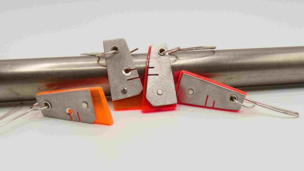 2 sets hebbe pewter earrings with neon pink/orange inserts and variable cut out reveals